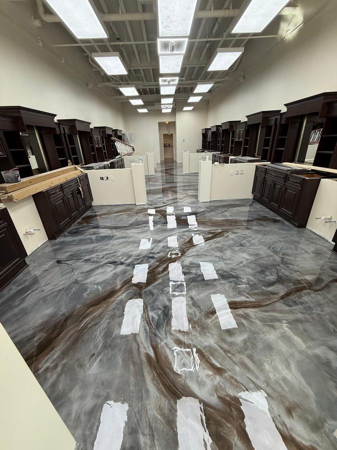 Bronze Smoke metallic floor on a real job — cabinet showroom