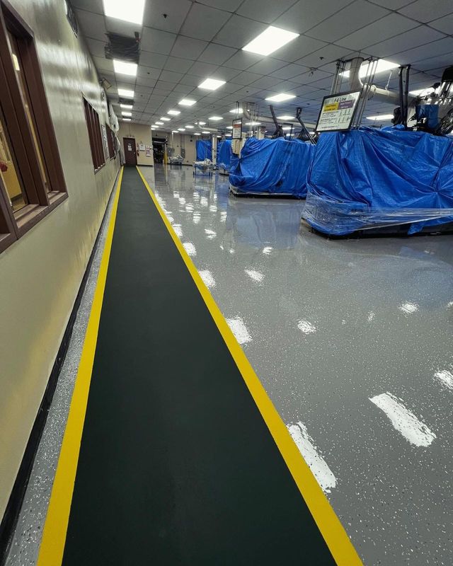 Grey flake with a marked walkway: flake system floor, commercial