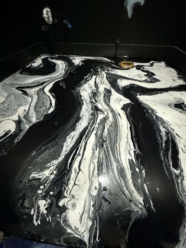 Black & white metallic, being poured: metallic epoxy floor, home interior