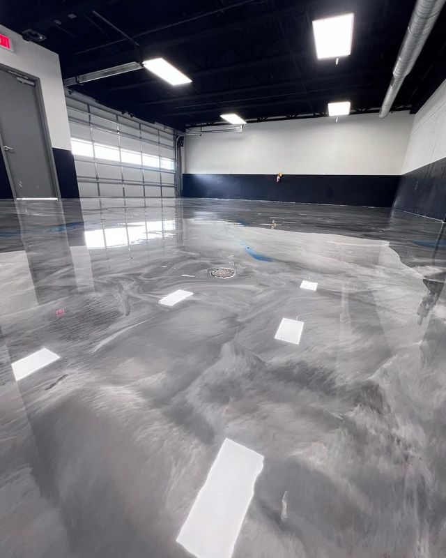Grey metallic, shop with drive-in doors: metallic epoxy floor, workshop