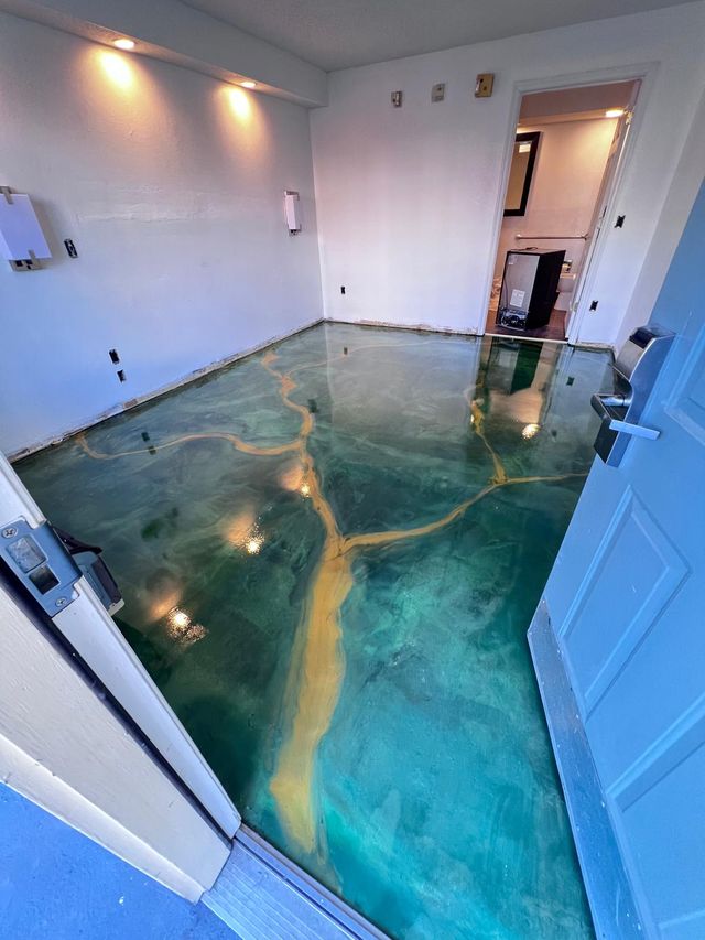 Teal metallic with a gold vein: metallic epoxy floor, home interior