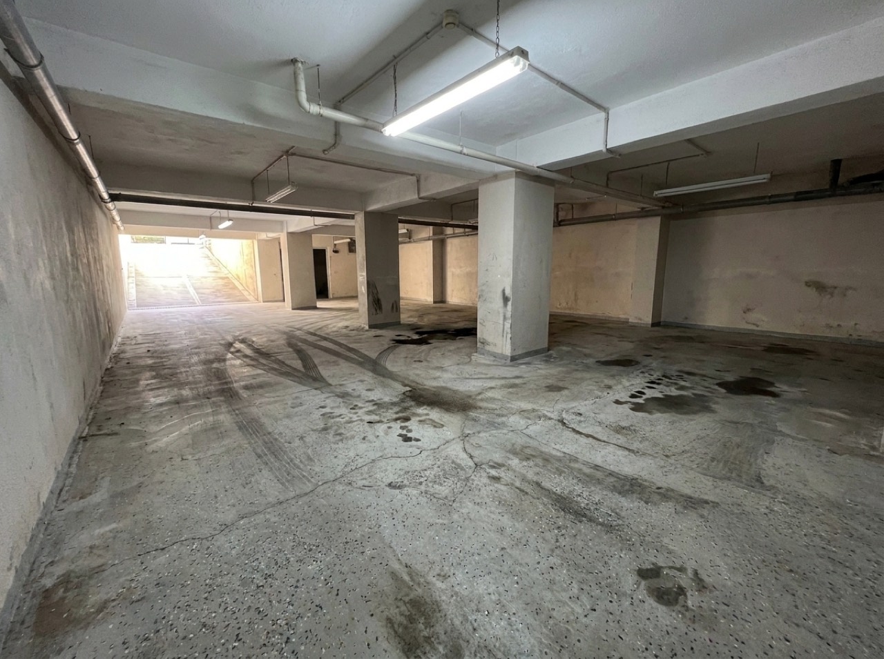 Worn floor before coating — commercial project