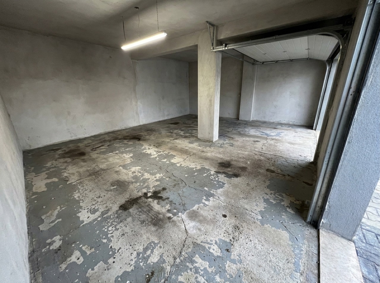 Worn floor before coating — 2-car project